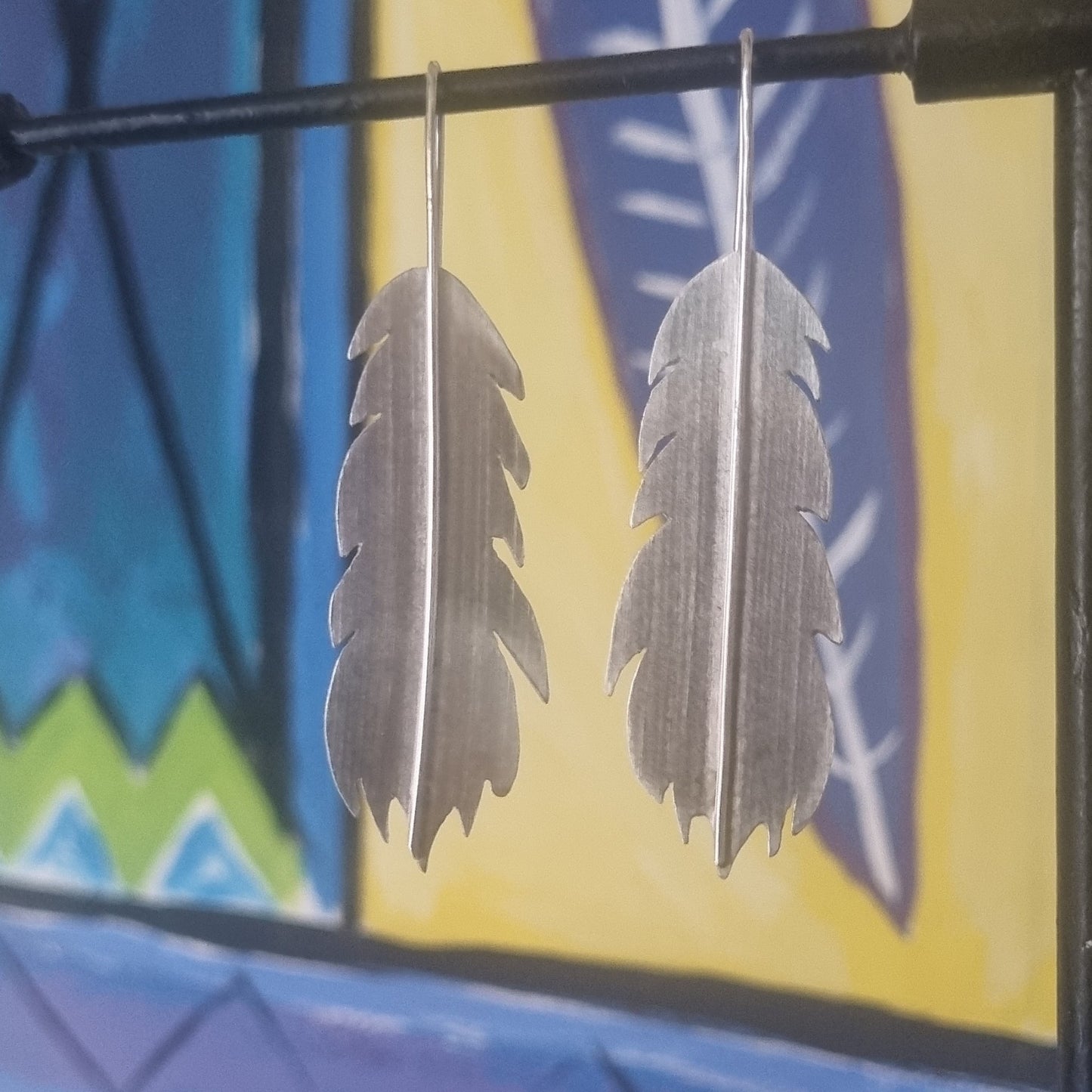 Huia feather earrings