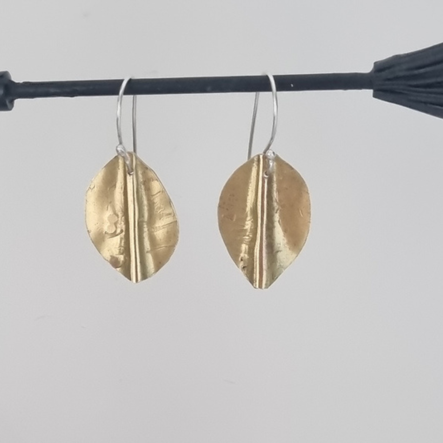 Pōhutukawa leaf earrings in brass