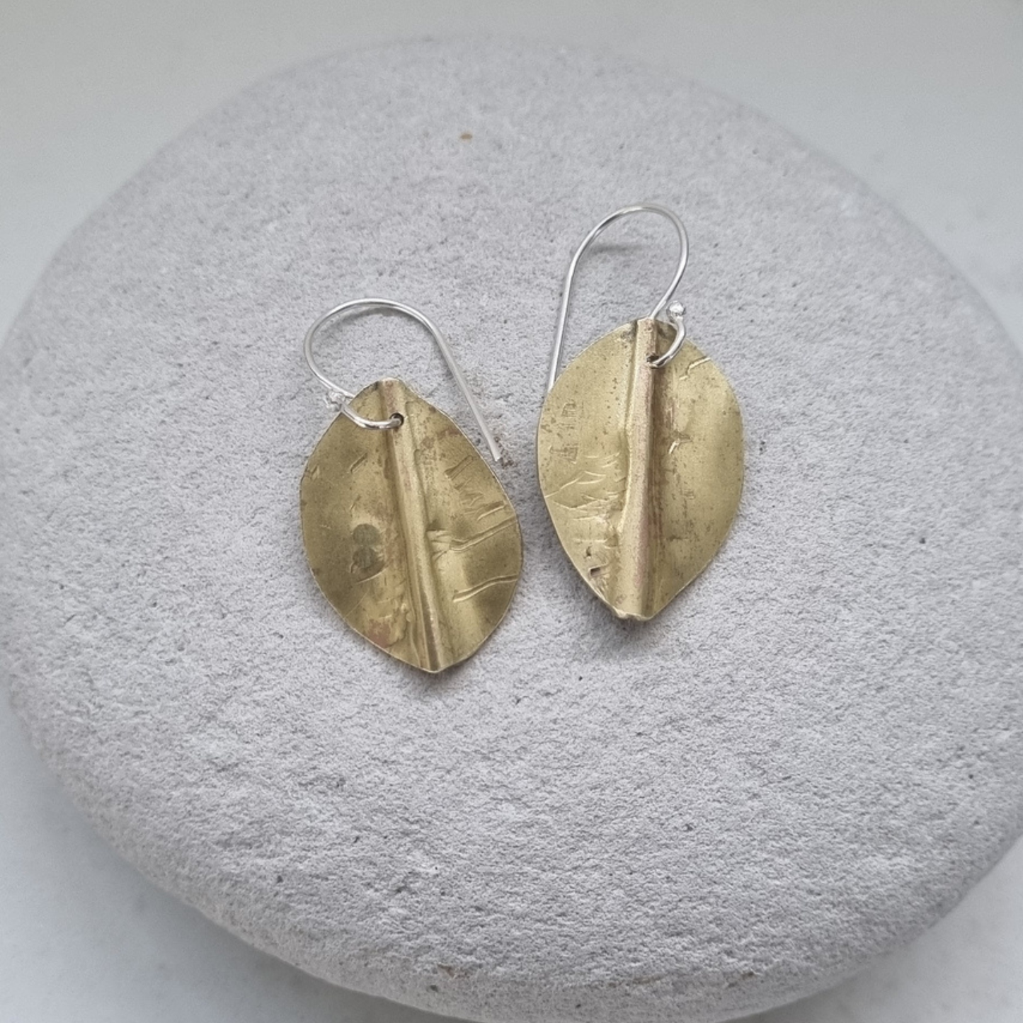 Pōhutukawa leaf earrings in brass
