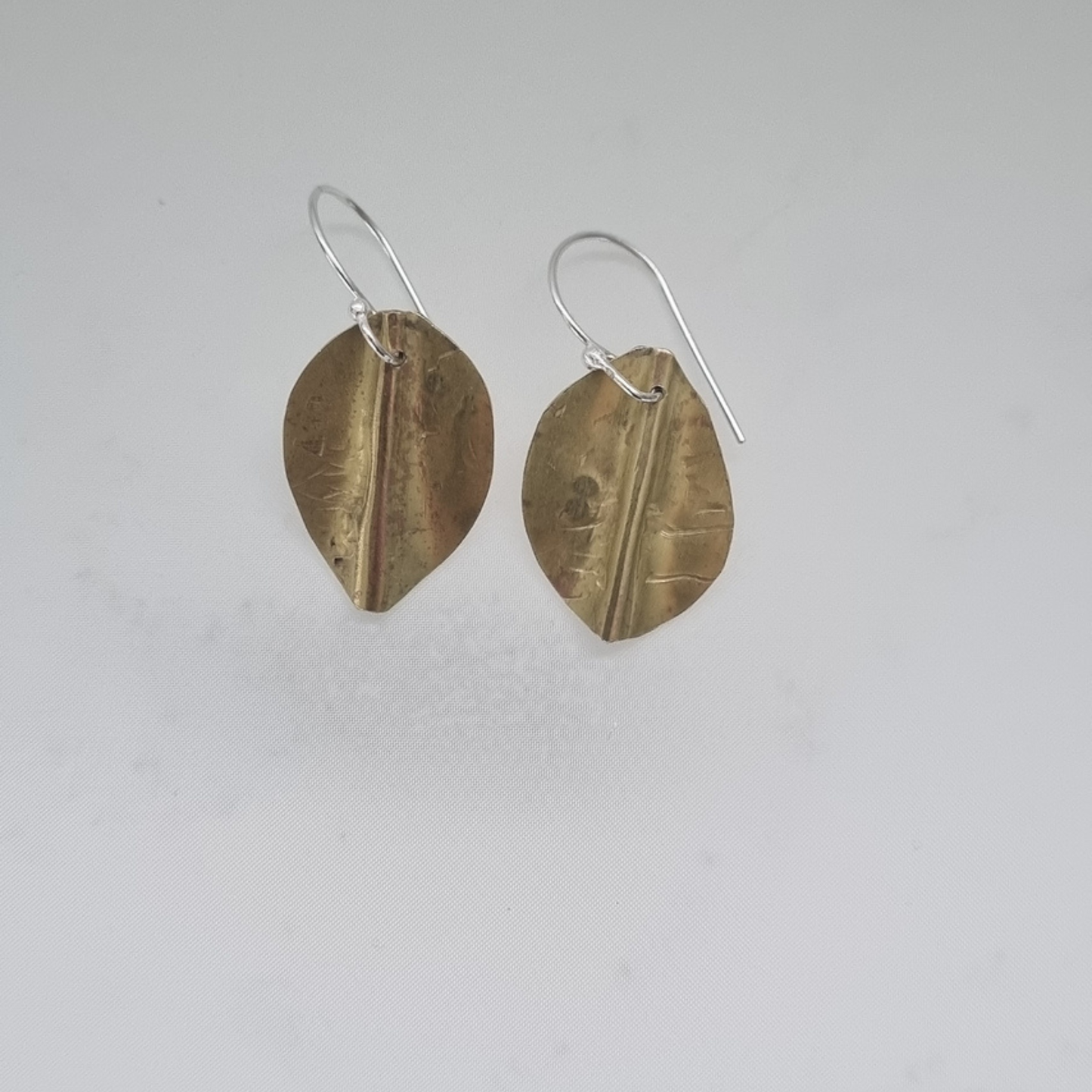 Pōhutukawa leaf earrings in brass