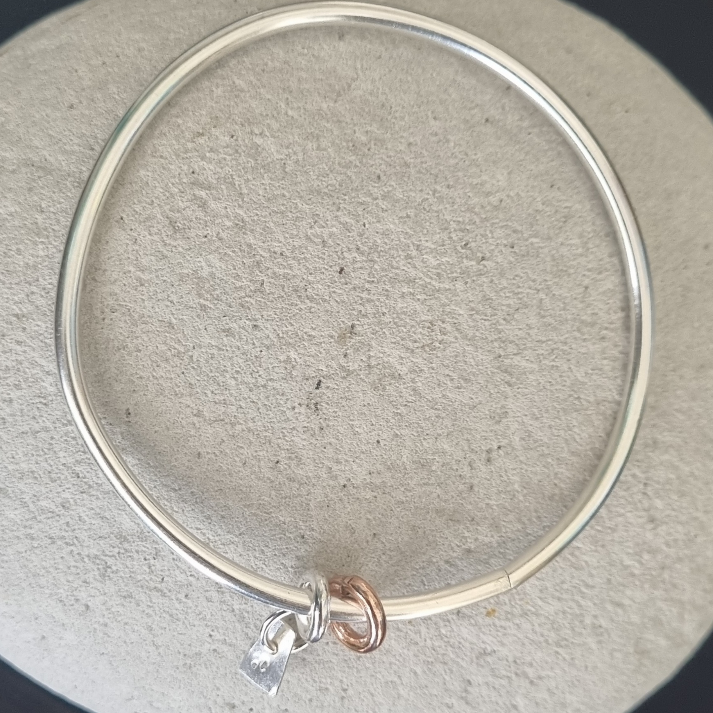Silver bangle with rings
